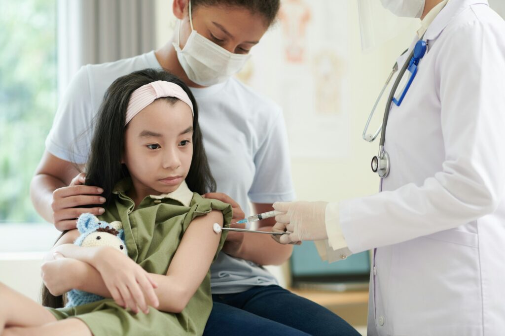 Girl Getting Shot of Vaccine